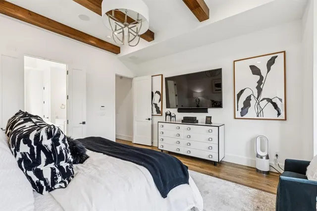 a kitchen with granite countertop a refrigerator and a sink