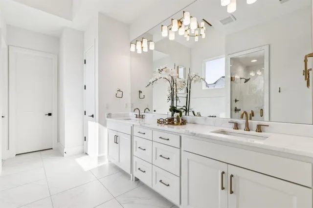 a living room with furniture a chandelier and a large window
