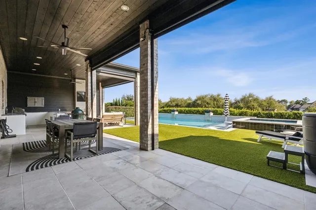 a kitchen with stainless steel appliances granite countertop a sink and a stove