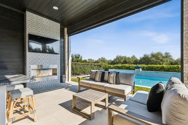 a view of a swimming pool with a patio