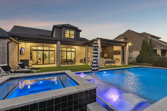 a living room with furniture pool table and a fireplace