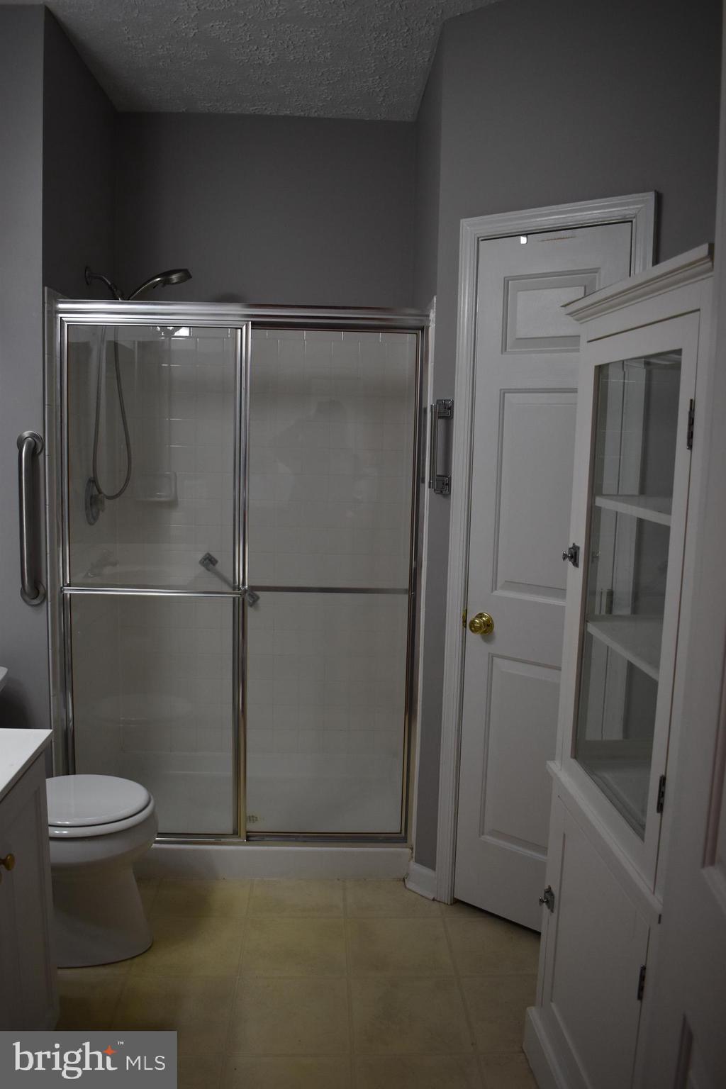 5236 Millfield Road, Unit 5236 Baltimore, MD 21237 - Photo 18 of 54 a bathroom with a toilet and a shower