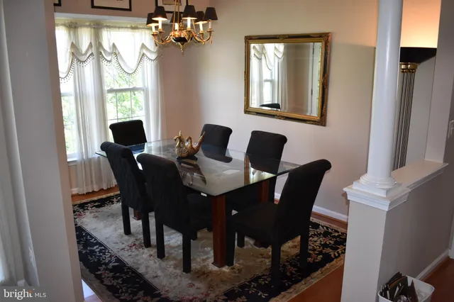 a dining room with furniture and window