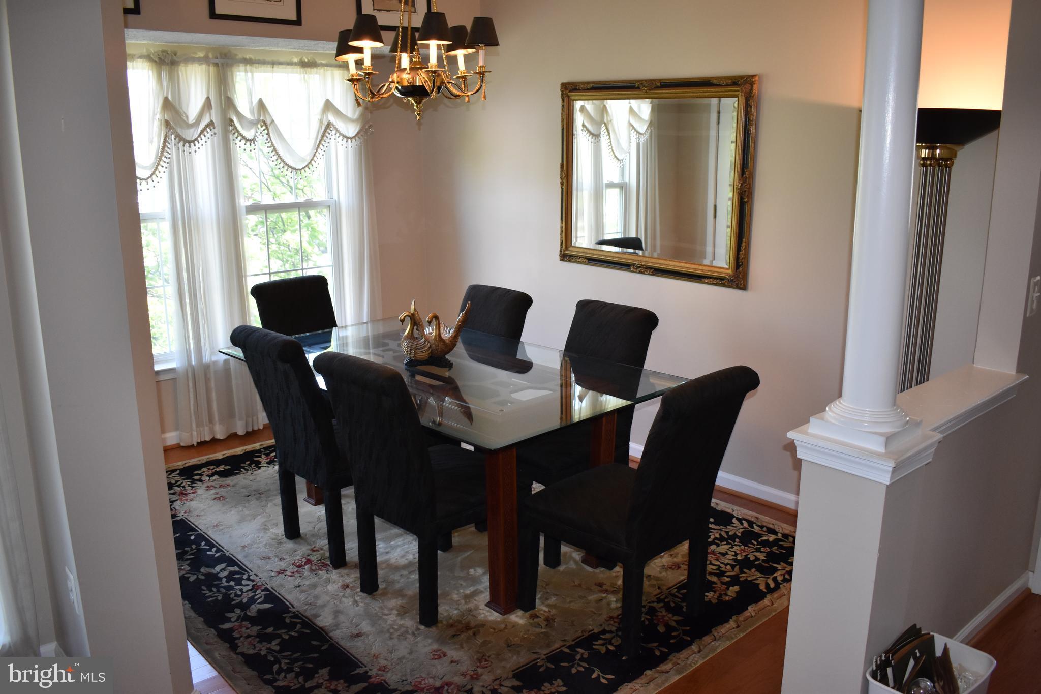 5236 Millfield Road, Unit 5236 Baltimore, MD 21237 - Photo 19 of 54 a view of a dining room with furniture window and outside view