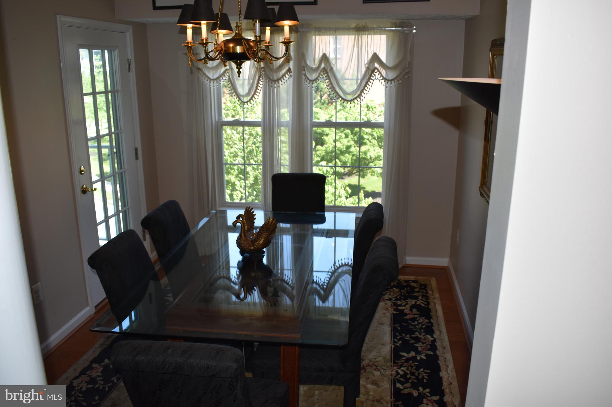 5236 Millfield Road, Unit 5236 Baltimore, MD 21237 - Photo 20 of 54 a dining room with furniture and window