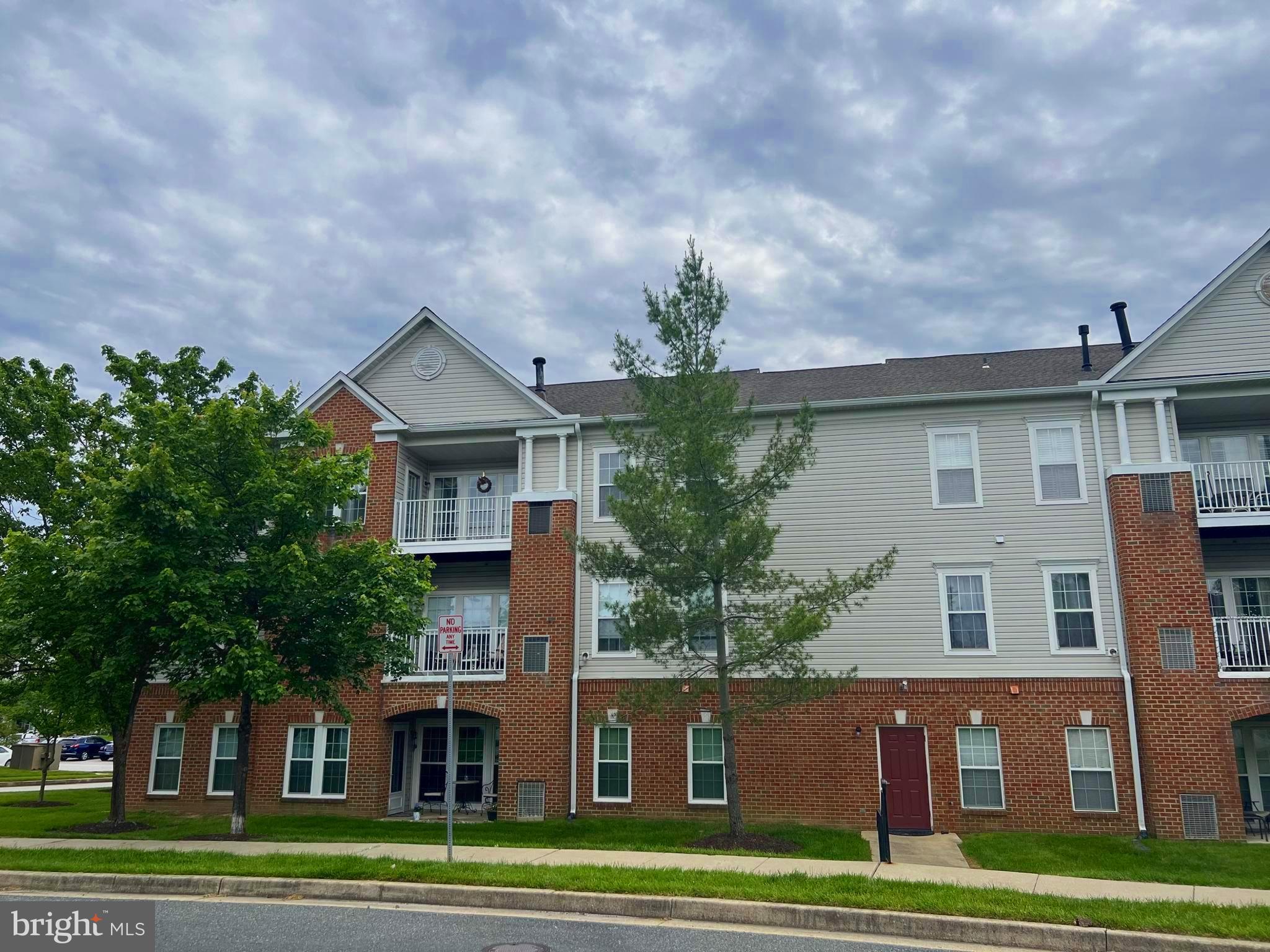 5236 Millfield Road, Unit 5236 Baltimore, MD 21237 - Photo 2 of 54 a front view of a house with a garden