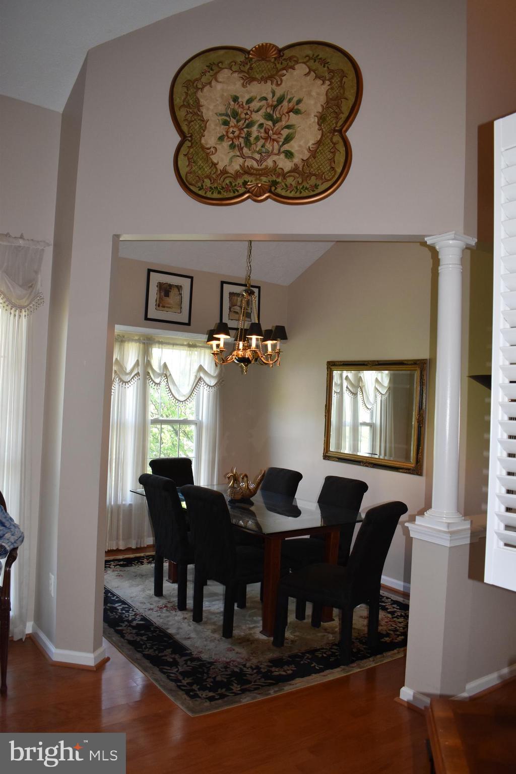 5236 Millfield Road, Unit 5236 Baltimore, MD 21237 - Photo 21 of 54 a dining room with furniture and chandelier