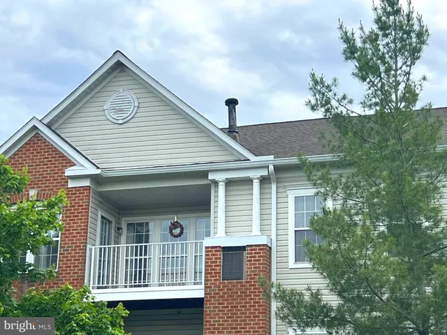 a front view of a house with a porch