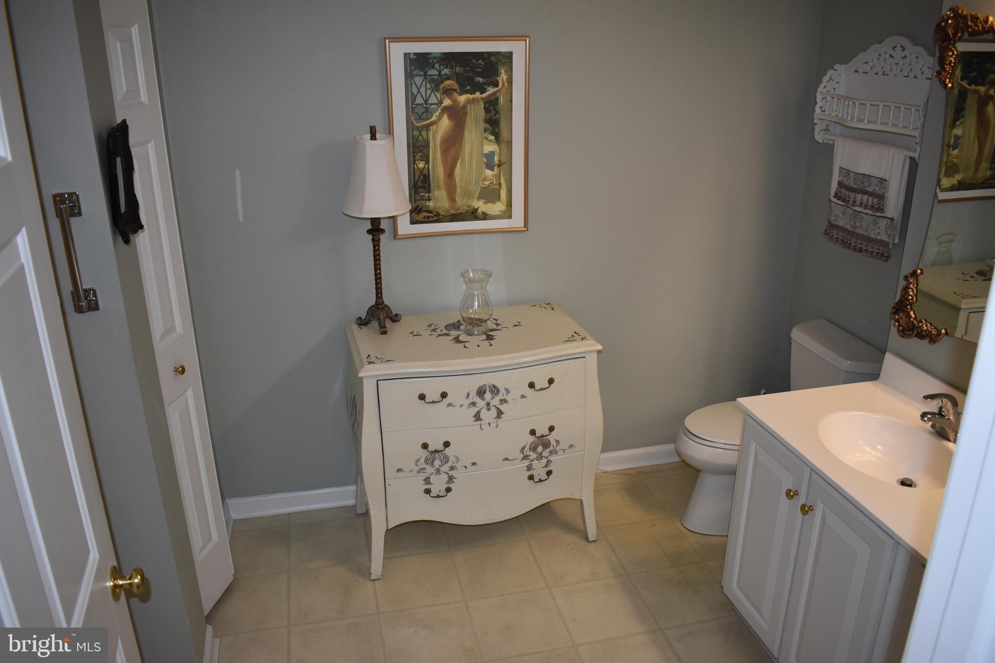5236 Millfield Road, Unit 5236 Baltimore, MD 21237 - Photo 45 of 54 a bathroom with a sink toilet and vanity