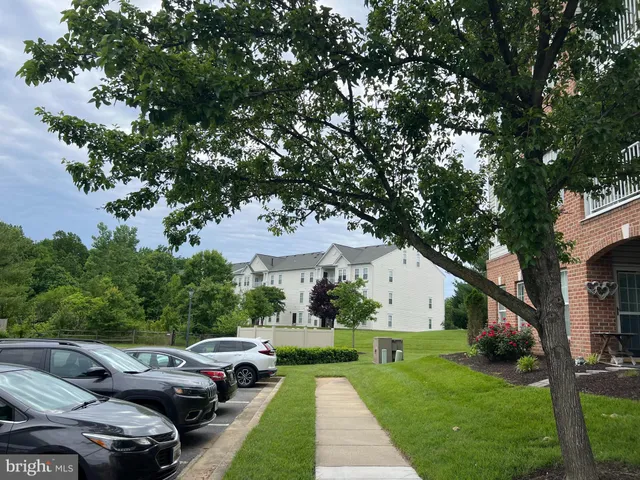 a view of yard with swimming pool and green space