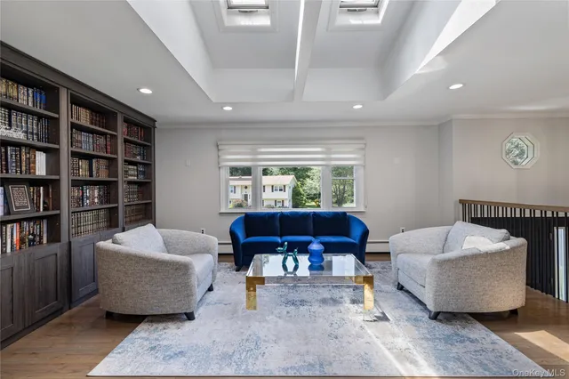 a bedroom with furniture and a wooden floor