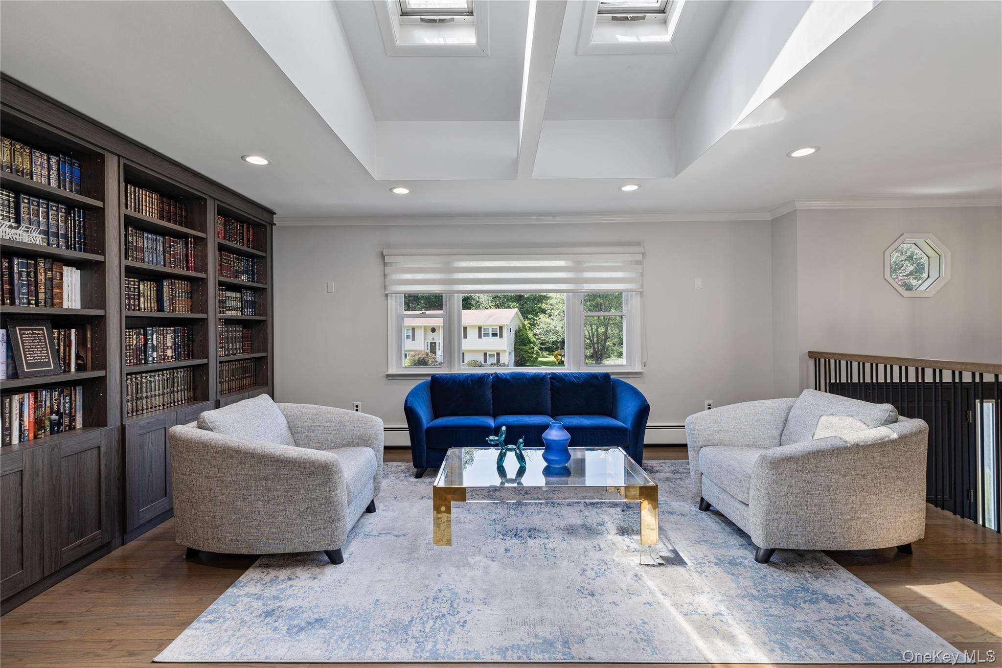 29 Skylark Drive Spring Valley, NY 10977 - Photo 12 of 44 a living room with furniture and a book shelf
