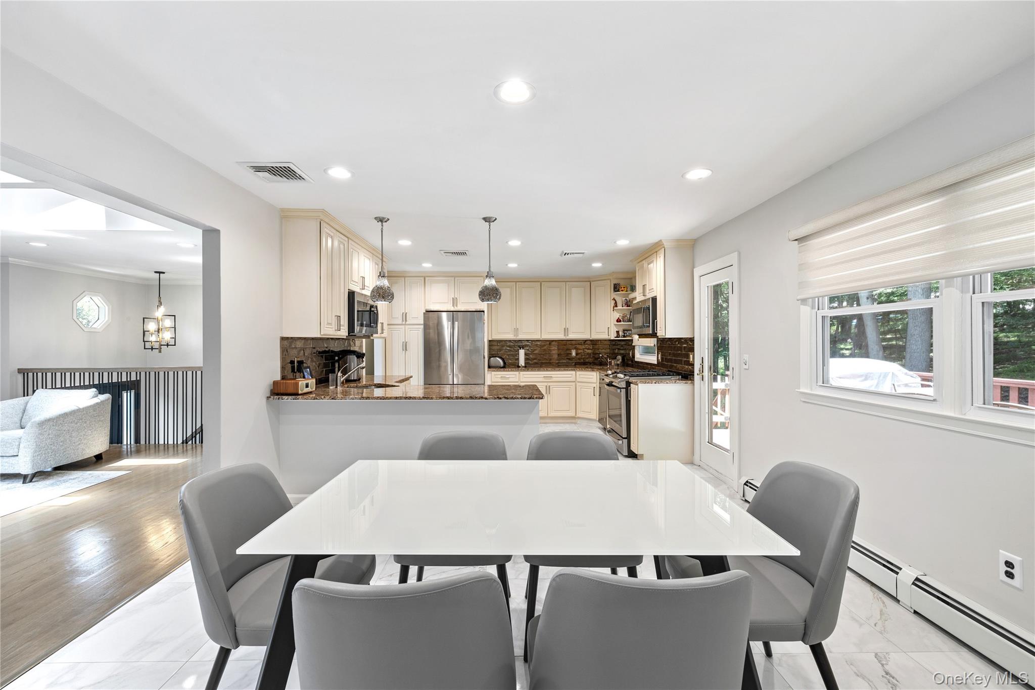 29 Skylark Drive Spring Valley, NY 10977 - Photo 14 of 44 a large kitchen with a table and chairs