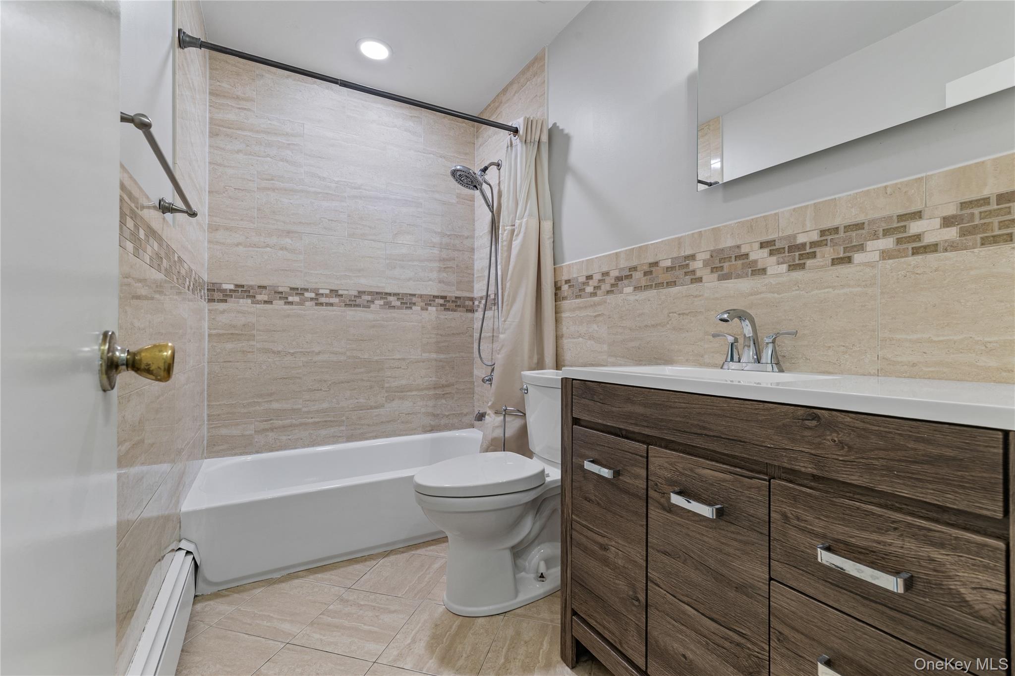 29 Skylark Drive Spring Valley, NY 10977 - Photo 23 of 44 a bathroom with a sink toilet and shower