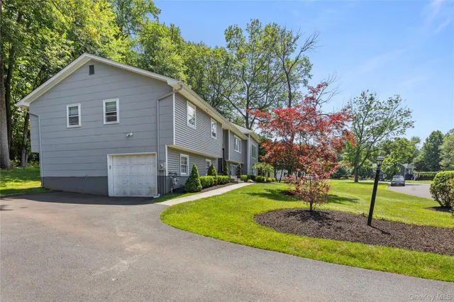 a living room with furniture and a book shelf