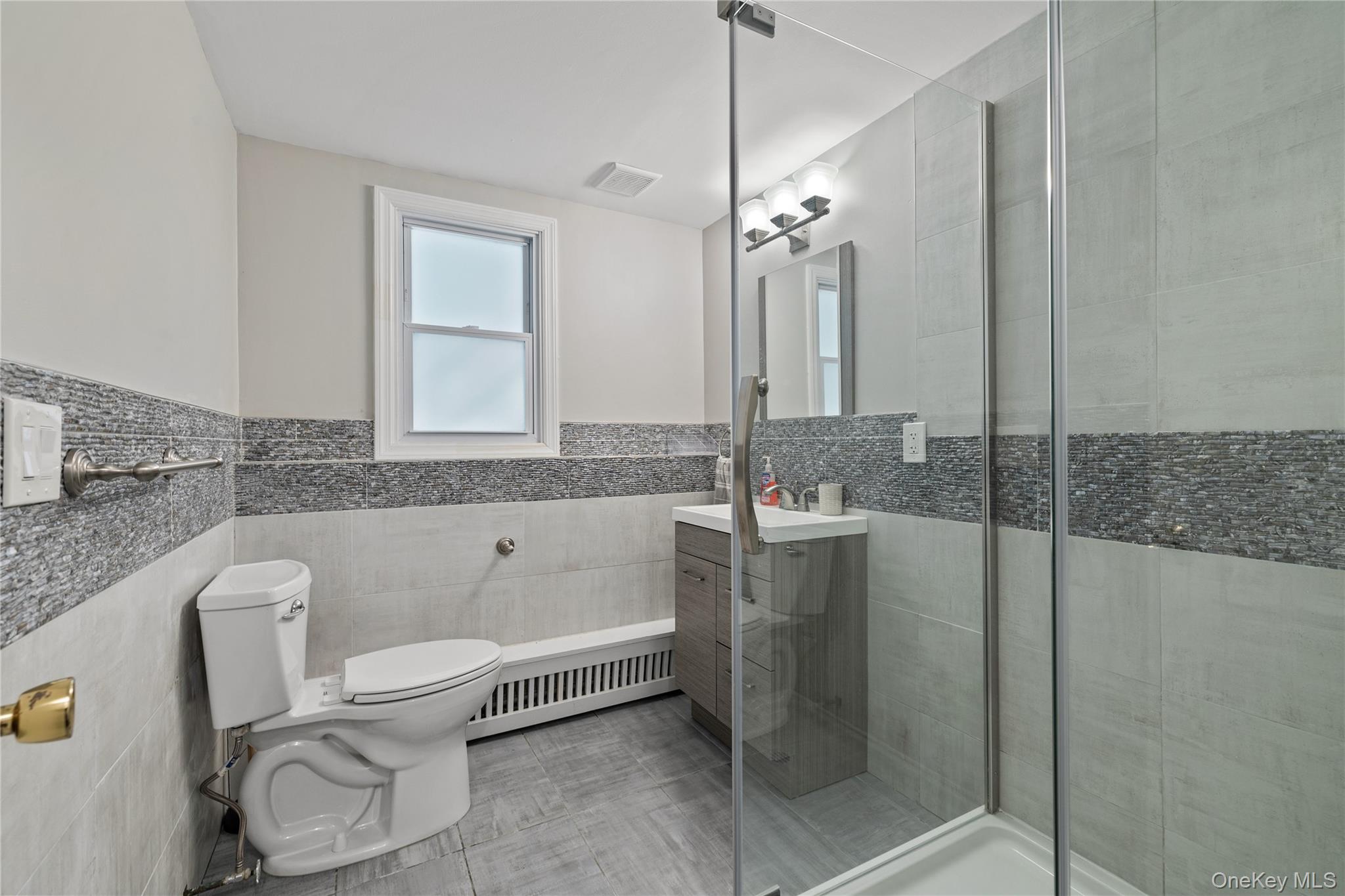 29 Skylark Drive Spring Valley, NY 10977 - Photo 35 of 44 a bathroom with a granite countertop sink a toilet and bathtub