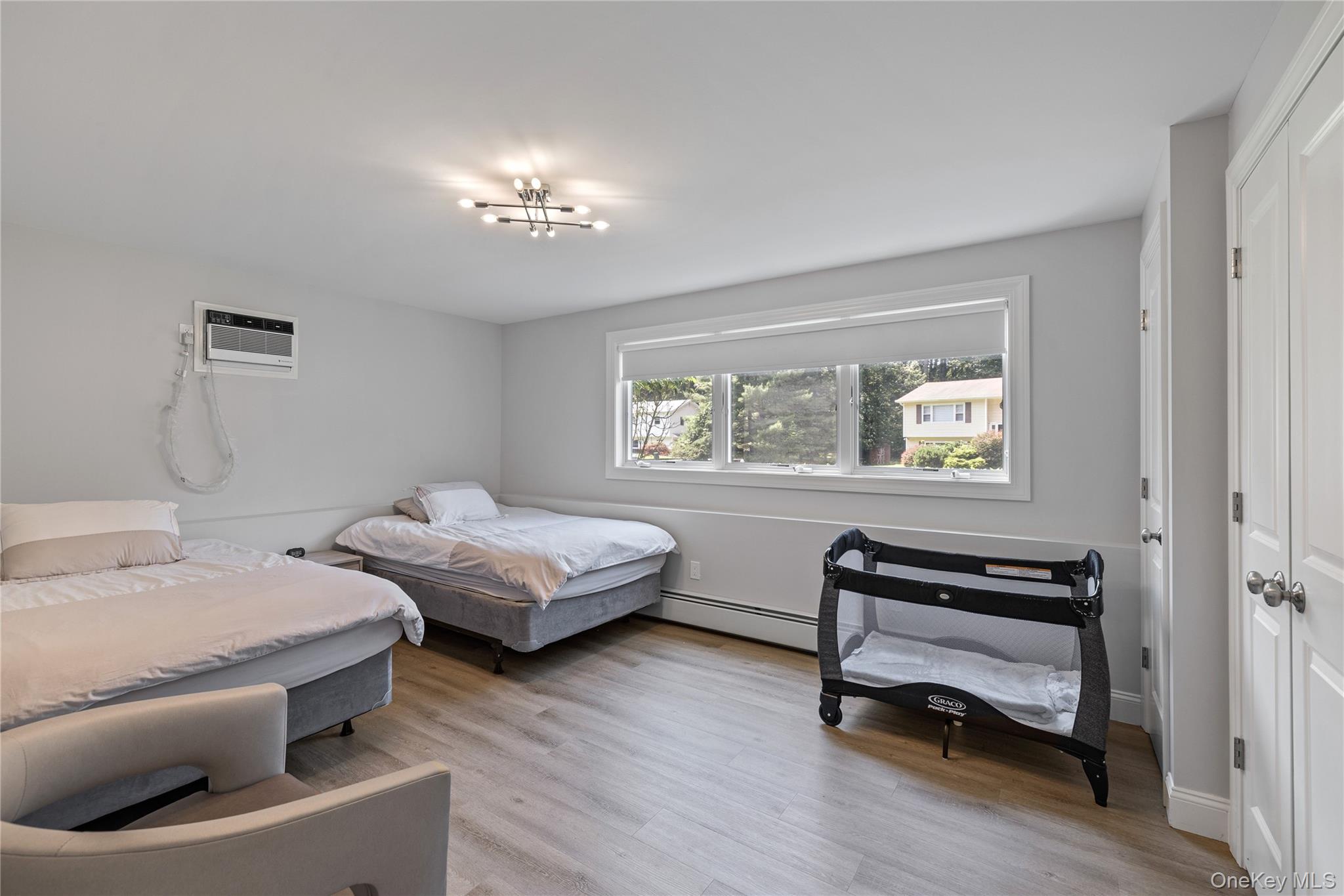 29 Skylark Drive Spring Valley, NY 10977 - Photo 39 of 44 a bedroom with furniture and a wooden floor