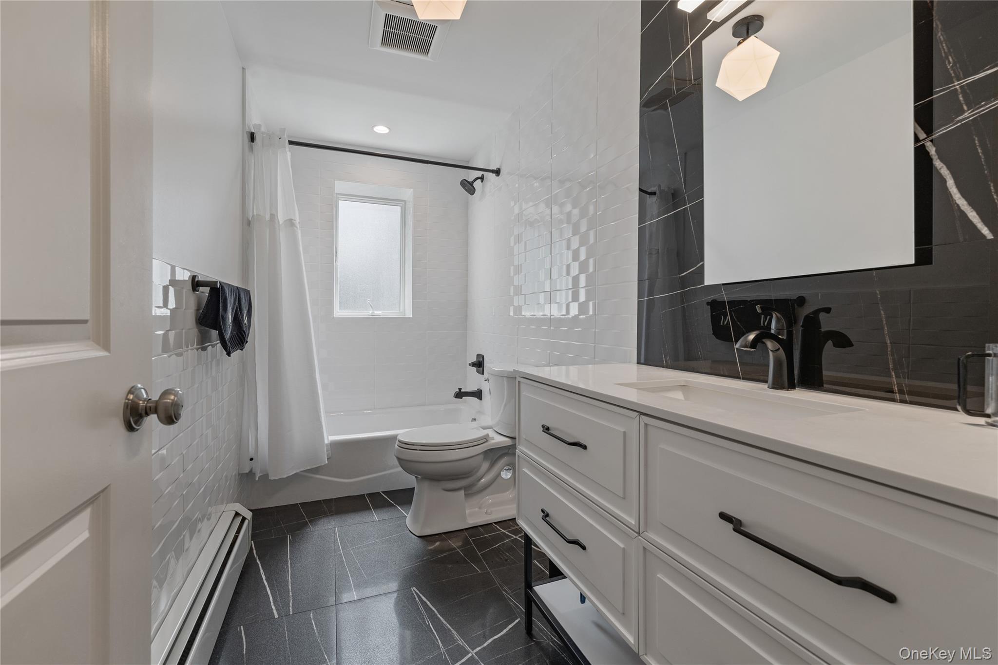 29 Skylark Drive Spring Valley, NY 10977 - Photo 42 of 44 a bathroom with a sink a toilet and shower