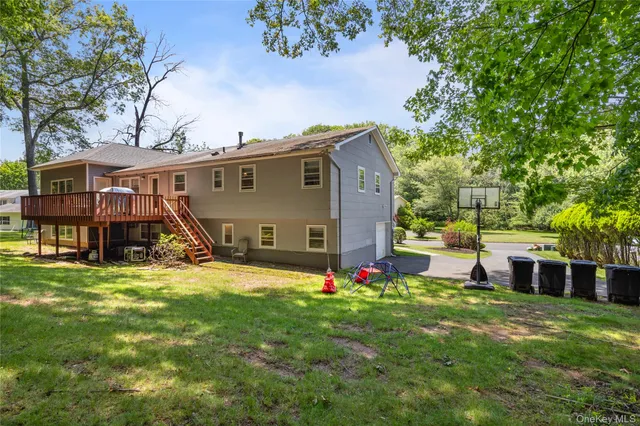 a kitchen with stainless steel appliances granite countertop a refrigerator a stove a sink a microwave oven with a dining table and chairs