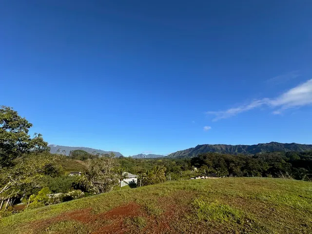 a view of mountain with sunset