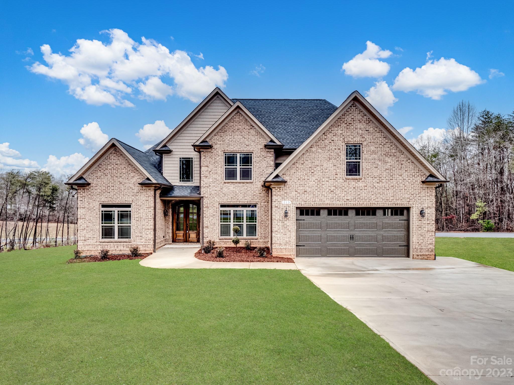 213 9th Street Northeast Conover, NC 28613 - Photo 1 of 38 a front view of a house with garden and patio