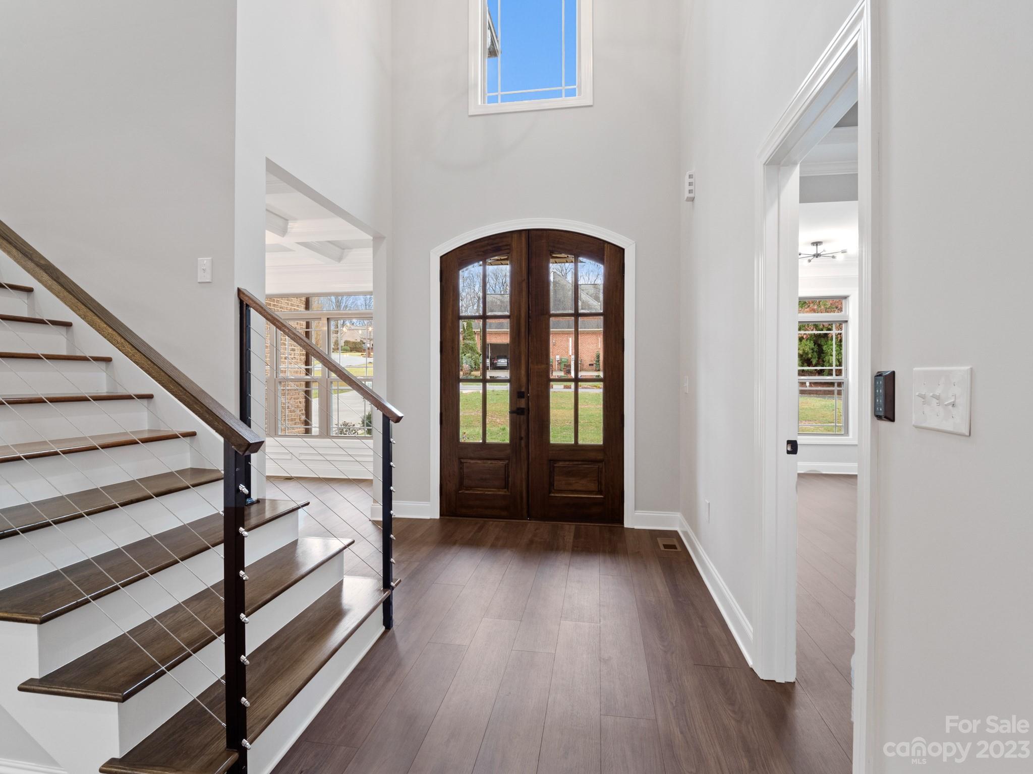 213 9th Street Northeast Conover, NC 28613 - Photo 18 of 38 a view of entryway with wooden floor and stairs