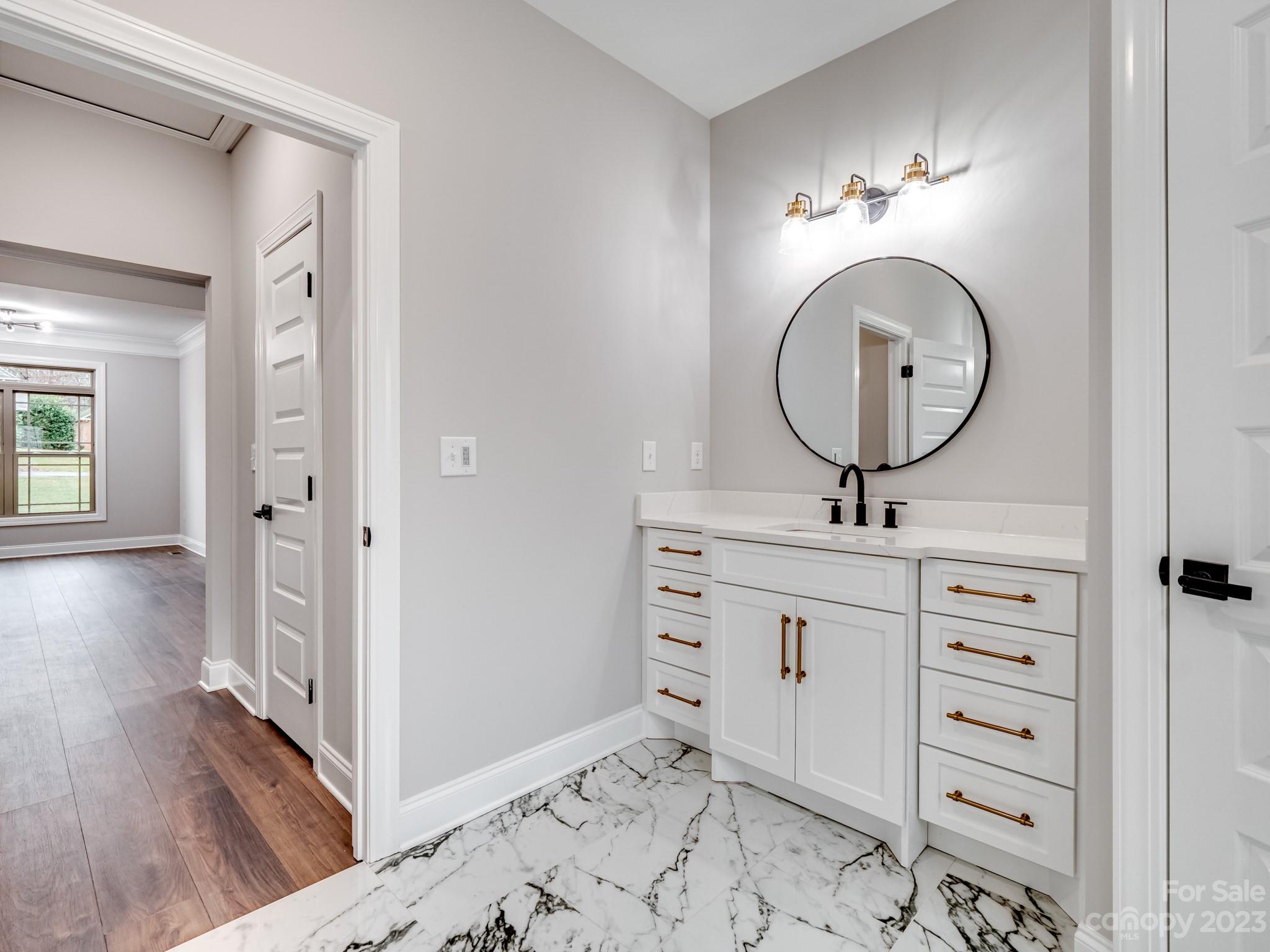 213 9th Street Northeast Conover, NC 28613 - Photo 23 of 38 a bathroom with a toilet a sink and a mirror