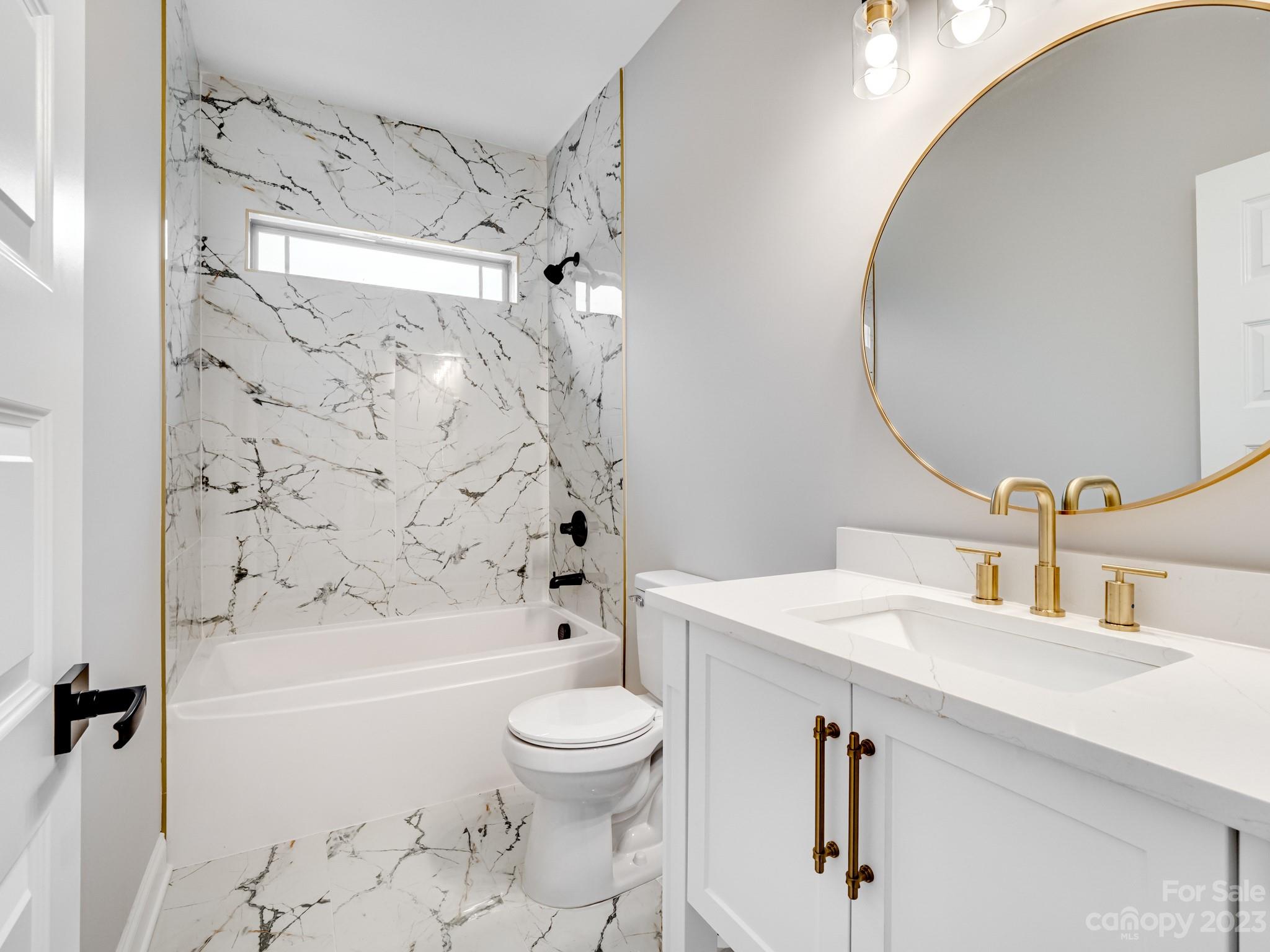 213 9th Street Northeast Conover, NC 28613 - Photo 25 of 38 a bathroom with a sink toilet vanity and shower