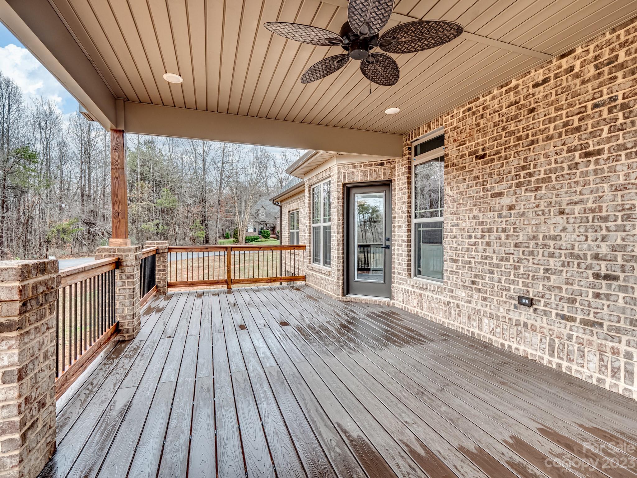 213 9th Street Northeast Conover, NC 28613 - Photo 3 of 38 a view of a porch with wooden floor and outdoor seating