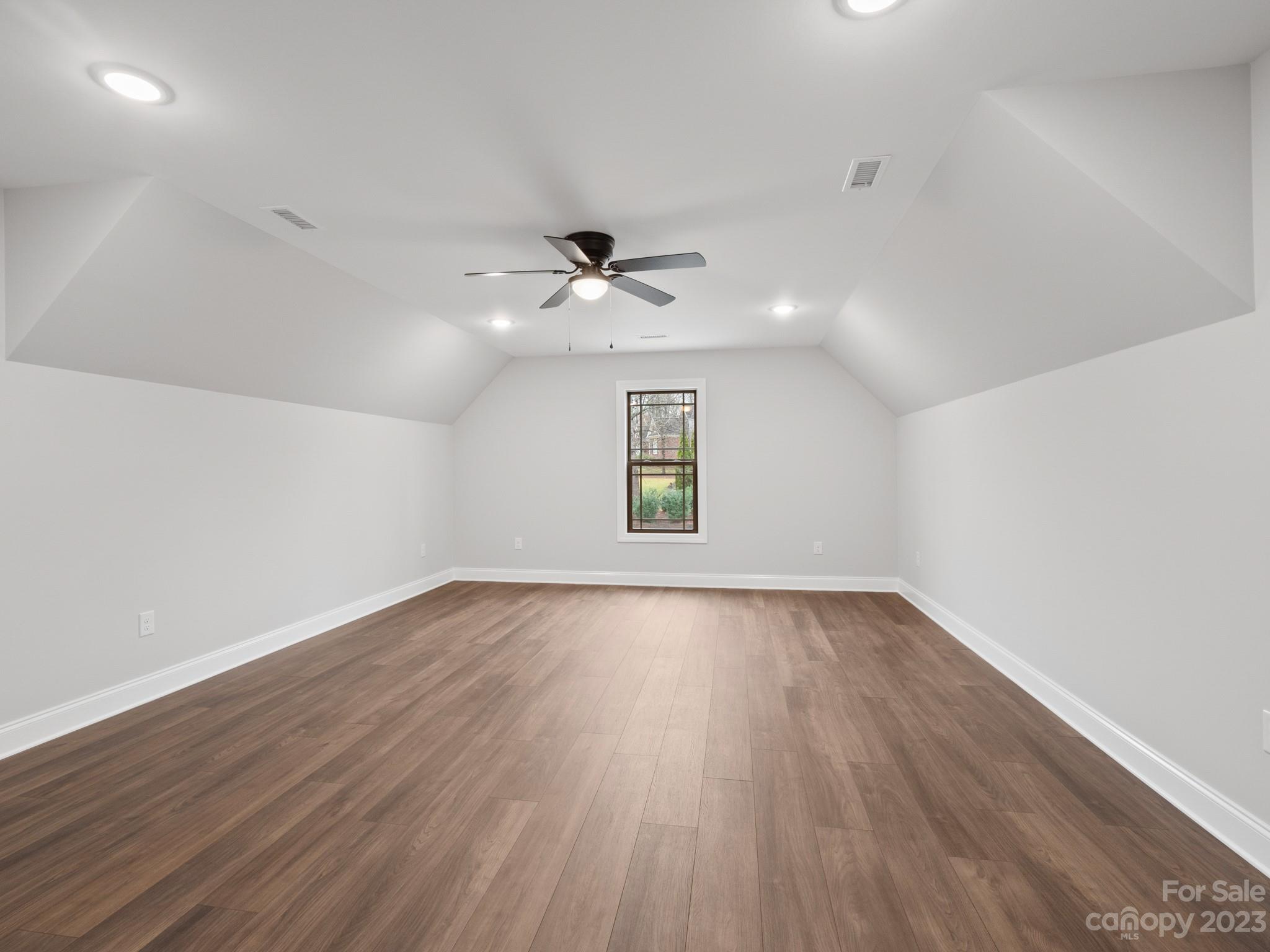 213 9th Street Northeast Conover, NC 28613 - Photo 32 of 38 wooden floor in an empty room with a window
