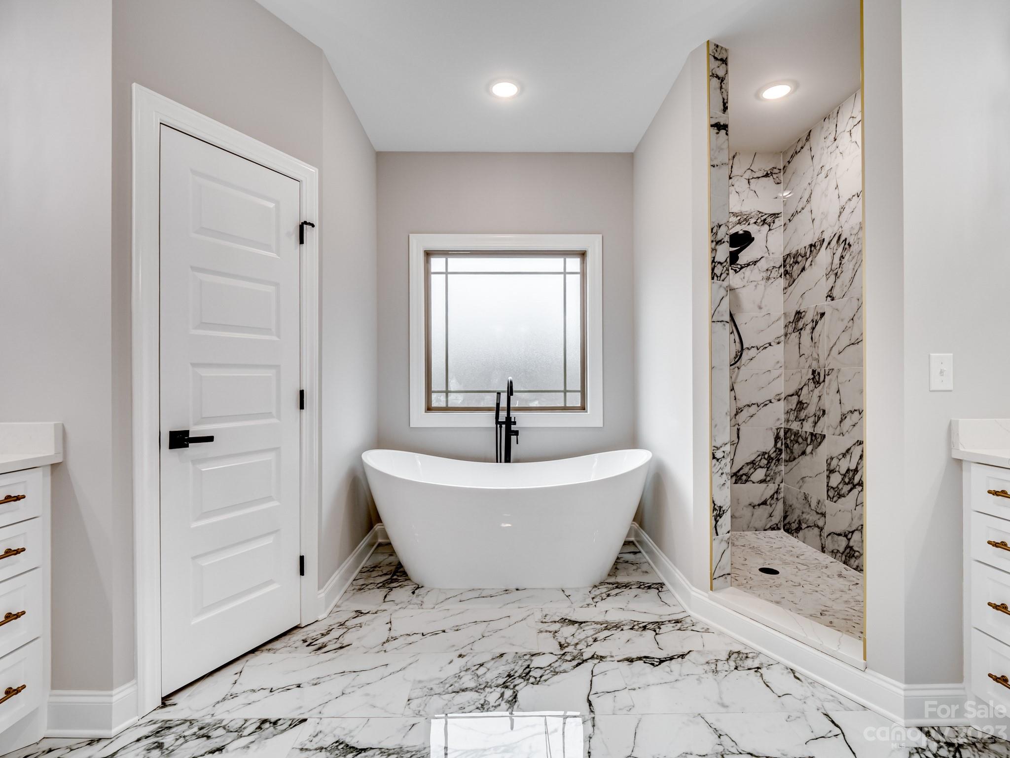 213 9th Street Northeast Conover, NC 28613 - Photo 5 of 38 a bath room with a bathtub and a shower