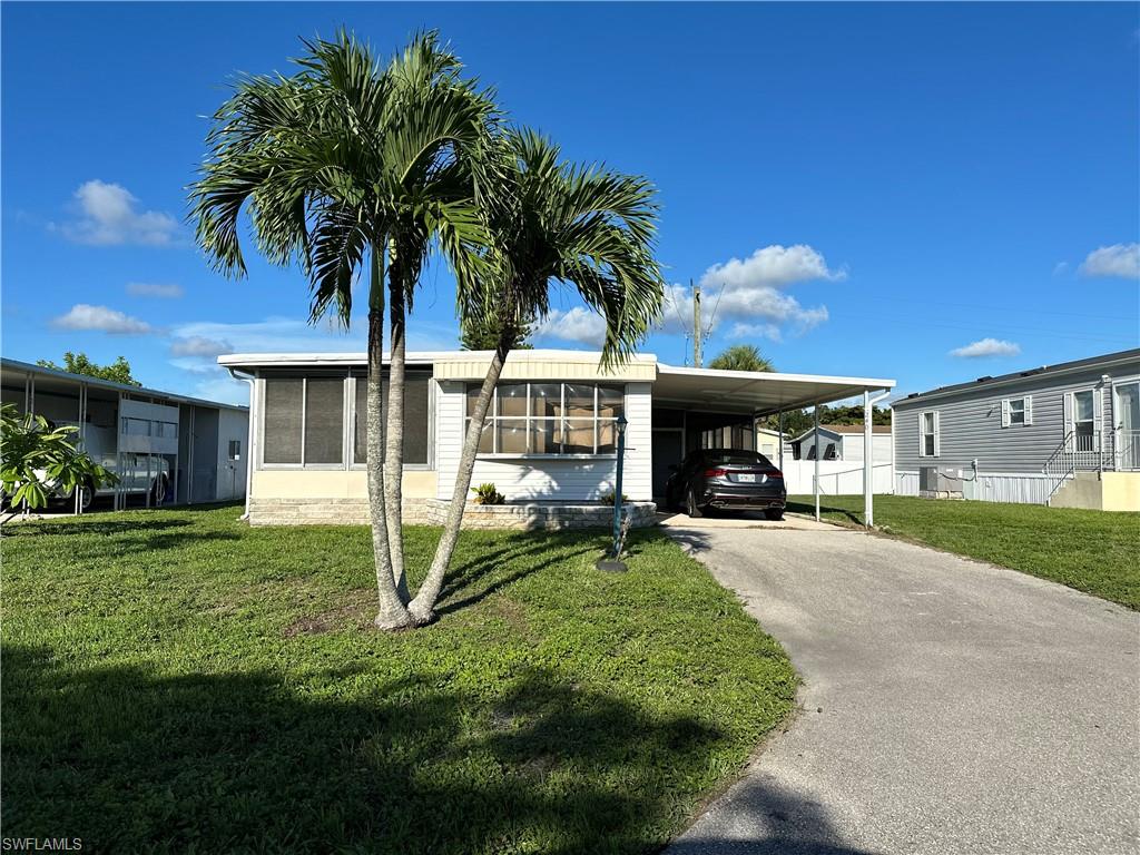 240 Cape Sable Drive Naples, FL 34104 - Photo 1 of 21 a view of a house with a yard and potted plants