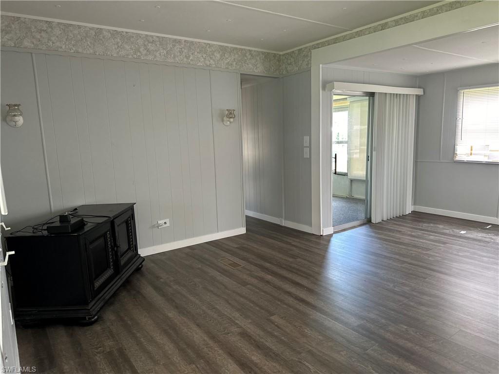 240 Cape Sable Drive Naples, FL 34104 - Photo 6 of 21 a view of a livingroom with wooden floor and a window
