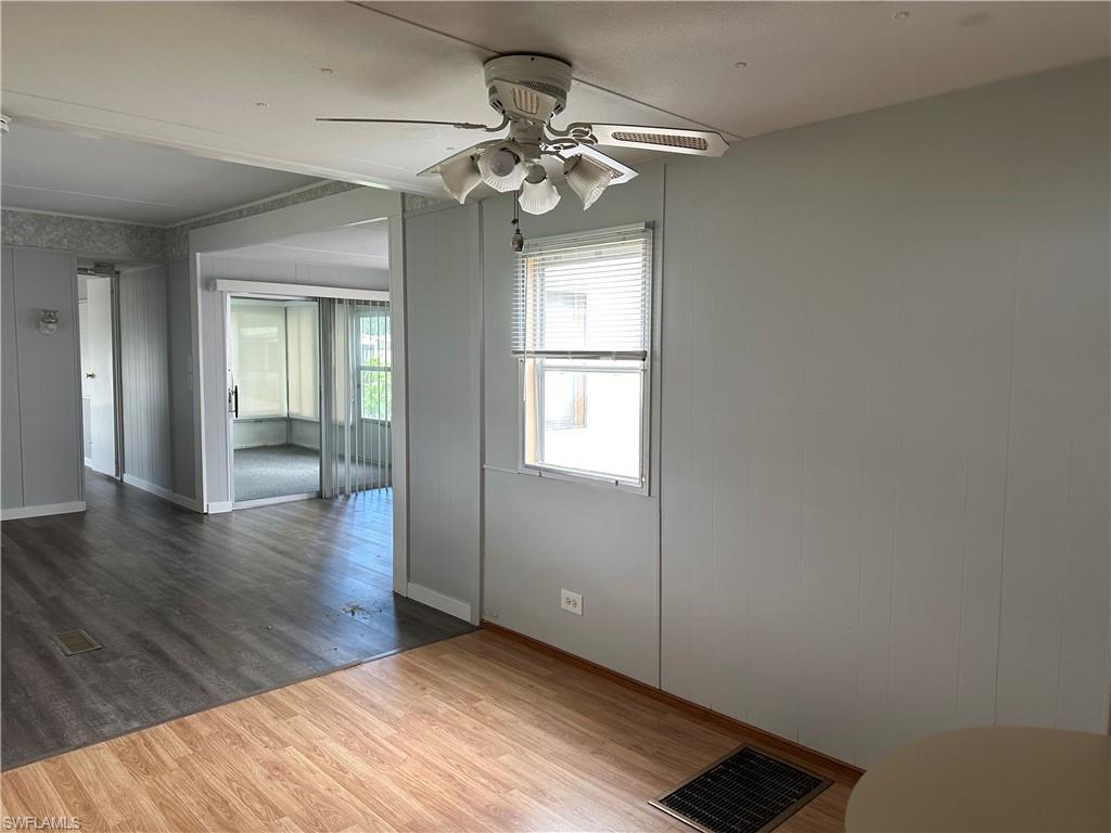 240 Cape Sable Drive Naples, FL 34104 - Photo 8 of 21 a view of an empty room with wooden floor