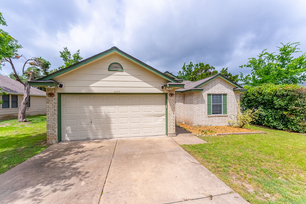a house view with a garden space