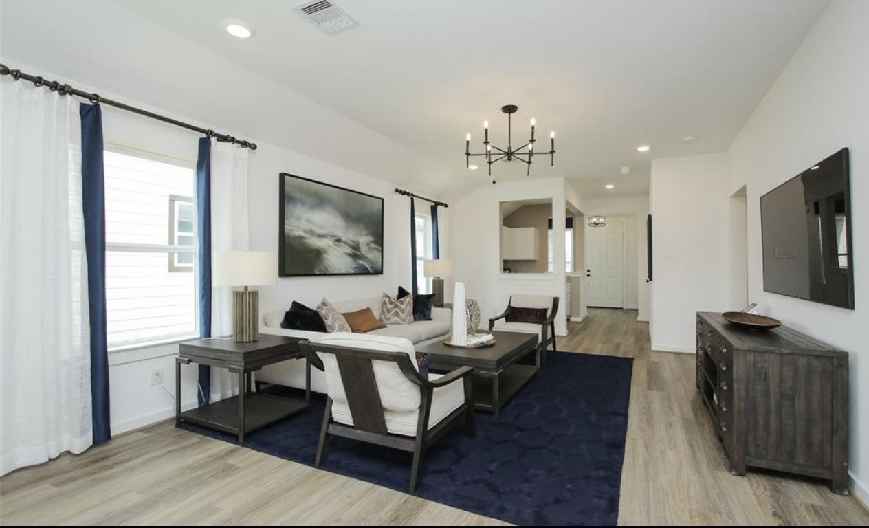 104 Lisa Marie Drive Angleton, TX 77515 - Photo 11 of 33 a living room with furniture and a flat screen tv