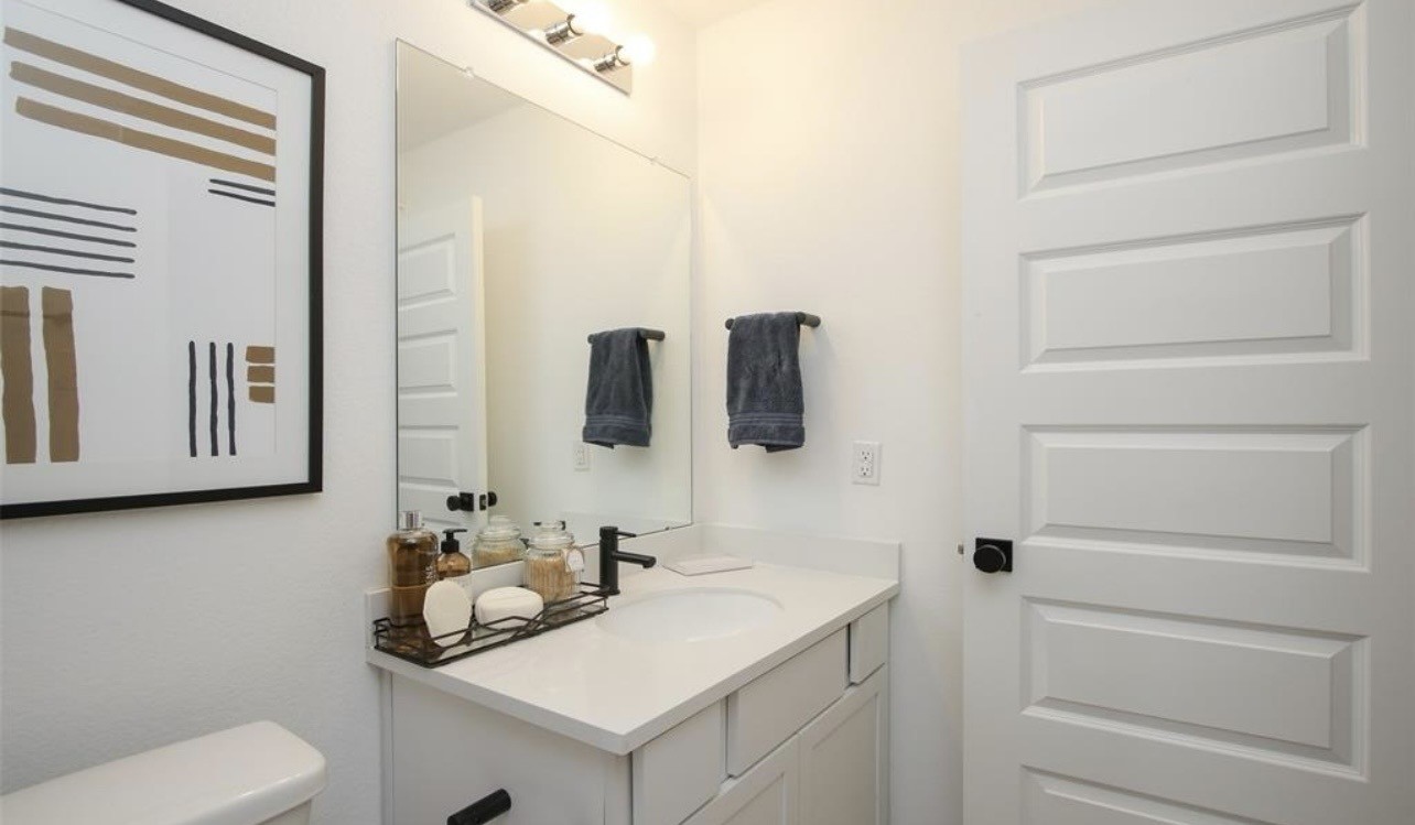 104 Lisa Marie Drive Angleton, TX 77515 - Photo 29 of 33 a bathroom with a sink and a mirror
