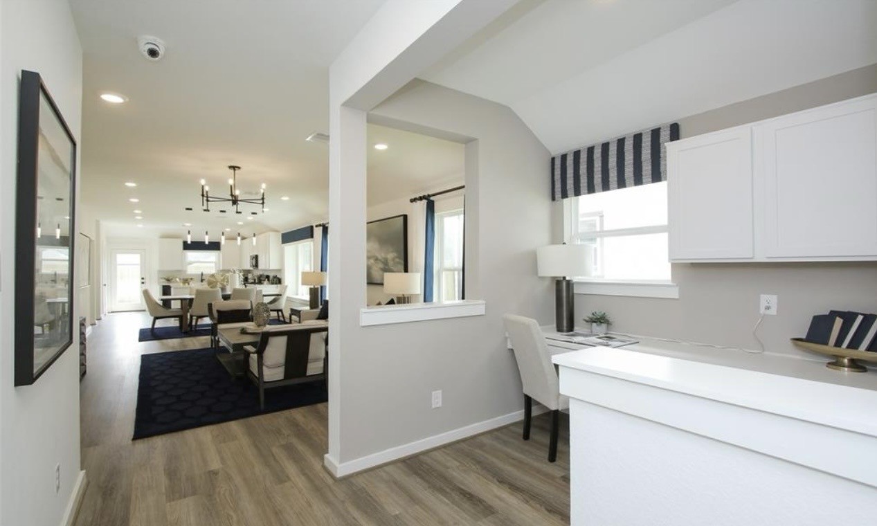104 Lisa Marie Drive Angleton, TX 77515 - Photo 8 of 33 a kitchen with stainless steel appliances kitchen island granite countertop a sink cabinets and wooden floor