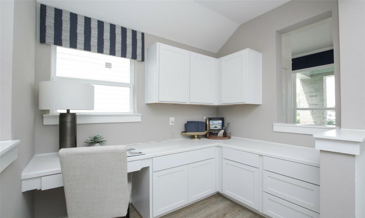 104 Lisa Marie Drive Angleton, TX 77515 - Photo 9 of 33 a kitchen with a sink cabinets and window
