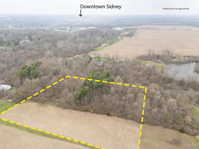 --- Childrens Home Road Sidney, OH 45365 - Photo 4 of 10 This aerial view showcases a vast expanse of natural landscape with nearby water features.