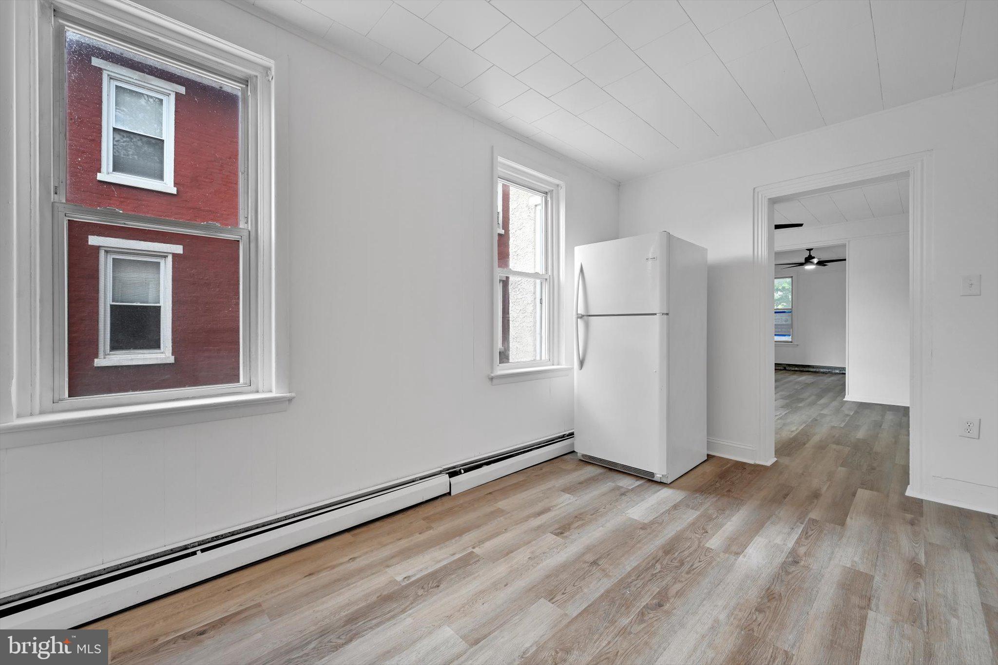 170 South Franklin Street Pottstown, PA 19464 - Photo 14 of 31 a view of a kitchen with wooden floor and a refrigerator