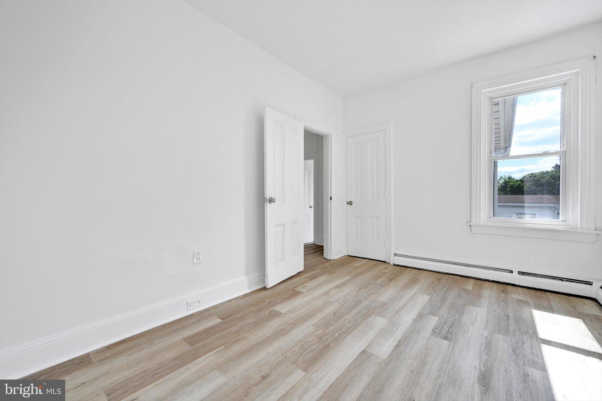170 South Franklin Street Pottstown, PA 19464 - Photo 21 of 31 an empty room with wooden floor and windows