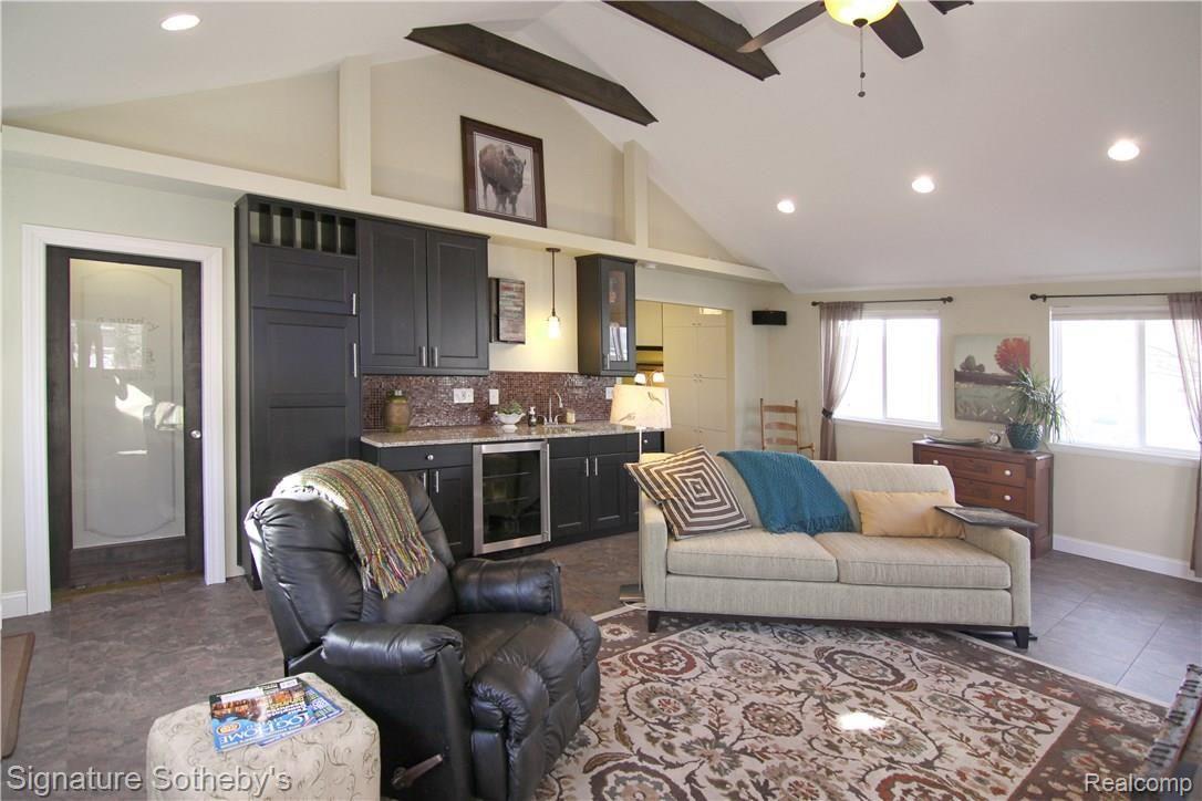 Huge bonus room, new addition, all updated, nice wet bar, surround sound, convenient to fenced in backyard with large deck and hot tub