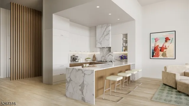 a large kitchen with stainless steel appliances granite countertop a stove a sink and a refrigerator