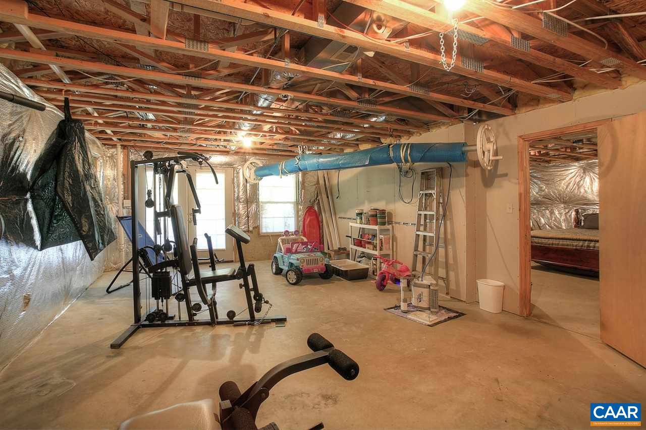 4099 Roundabout Road Louisa, VA 23093 - Photo 18 of 25 a view of a room with gym equipment