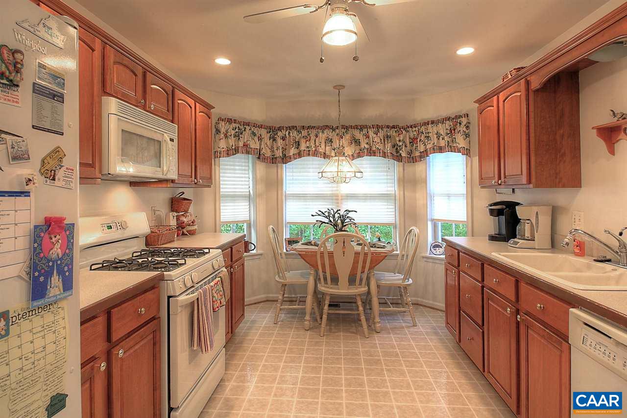 4099 Roundabout Road Louisa, VA 23093 - Photo 5 of 25 a kitchen with stainless steel appliances granite countertop a stove a sink dishwasher and a refrigerator