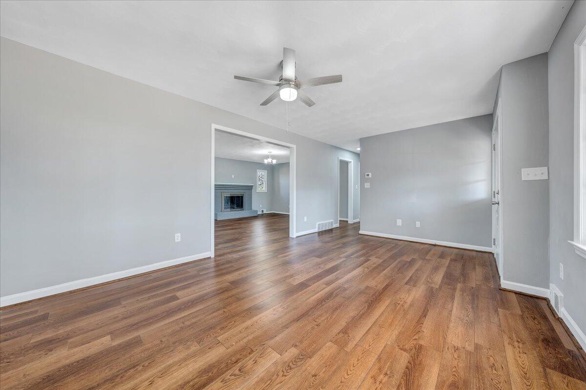 2353 Thompson Ridge Road Ferrum, VA 24088 - Photo 6 of 46 wooden floor in an empty room with a window