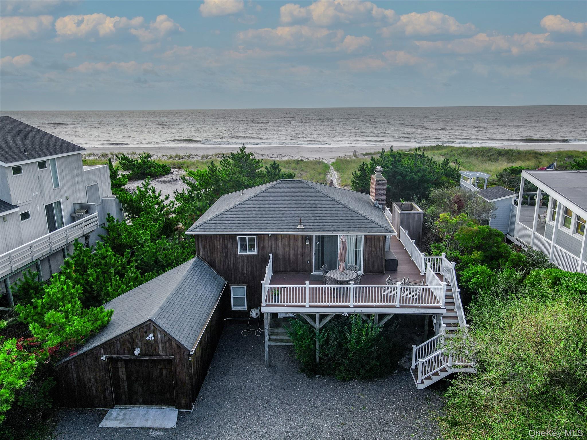 645 Dune Road Westhampton, NY 11978 - Photo 17 of 30 an aerial view of a house with yard porch and furniture