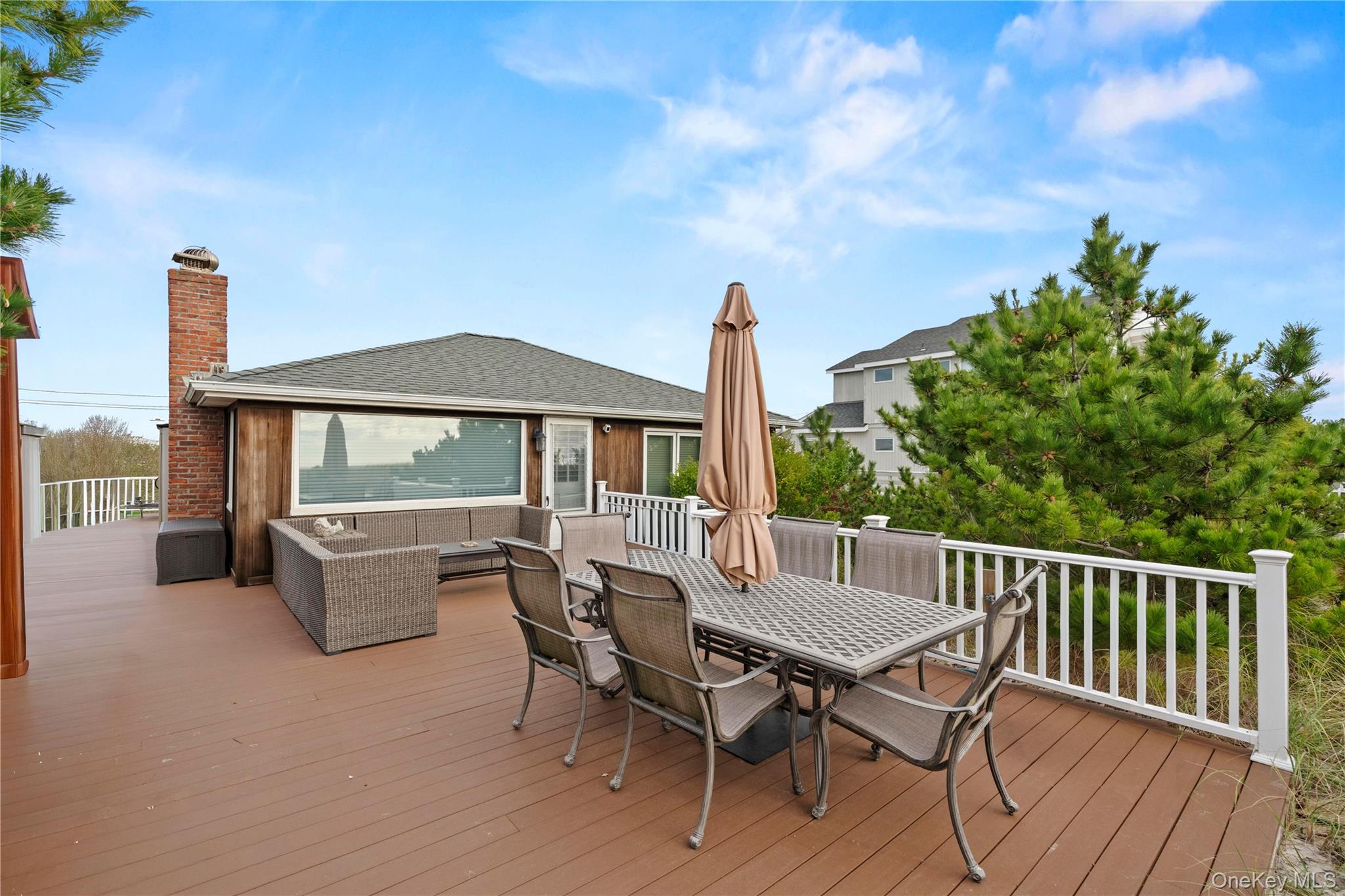 645 Dune Road Westhampton, NY 11978 - Photo 25 of 30 a view of balcony with furniture and stove