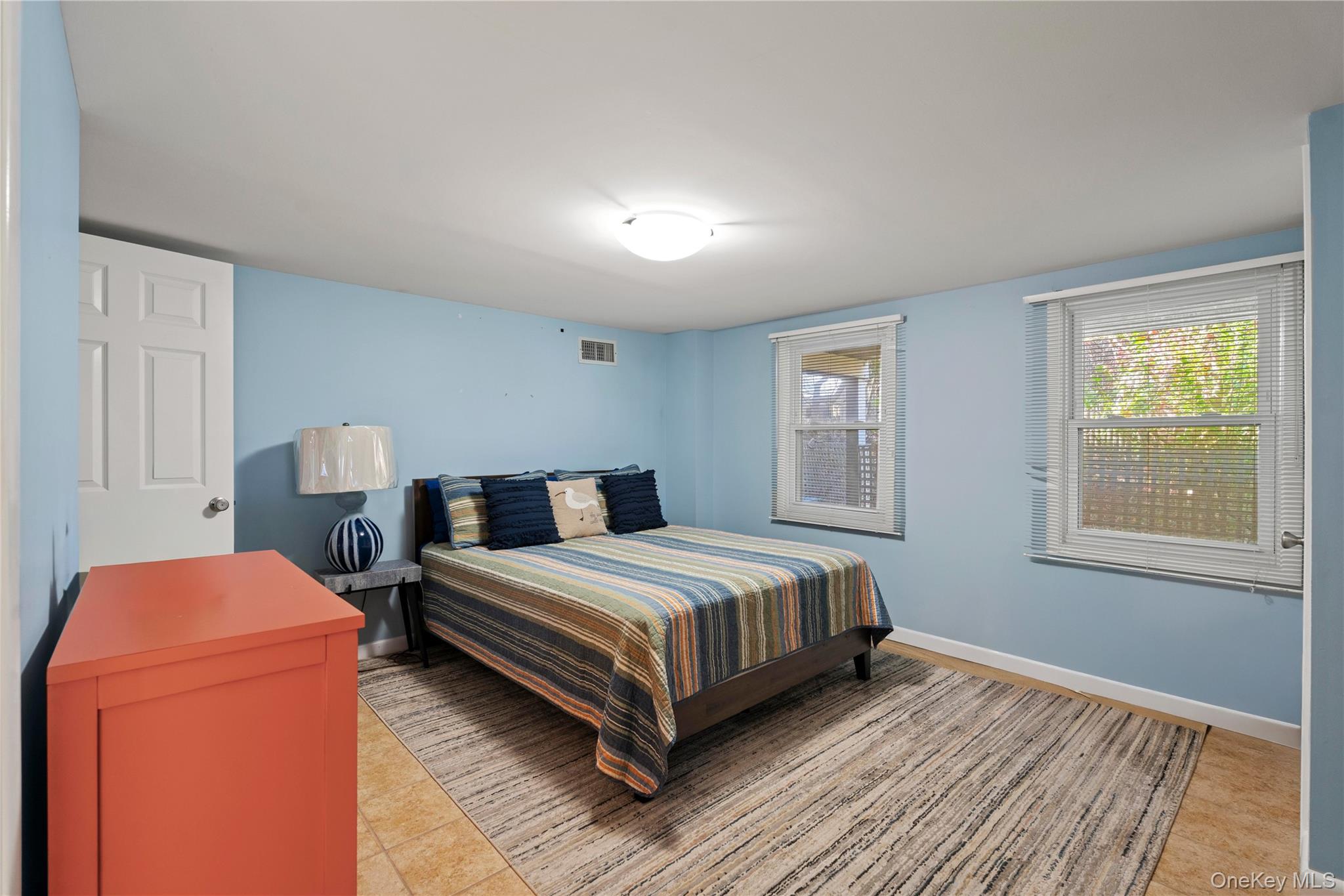 645 Dune Road Westhampton, NY 11978 - Photo 26 of 30 a bedroom with a bed and window